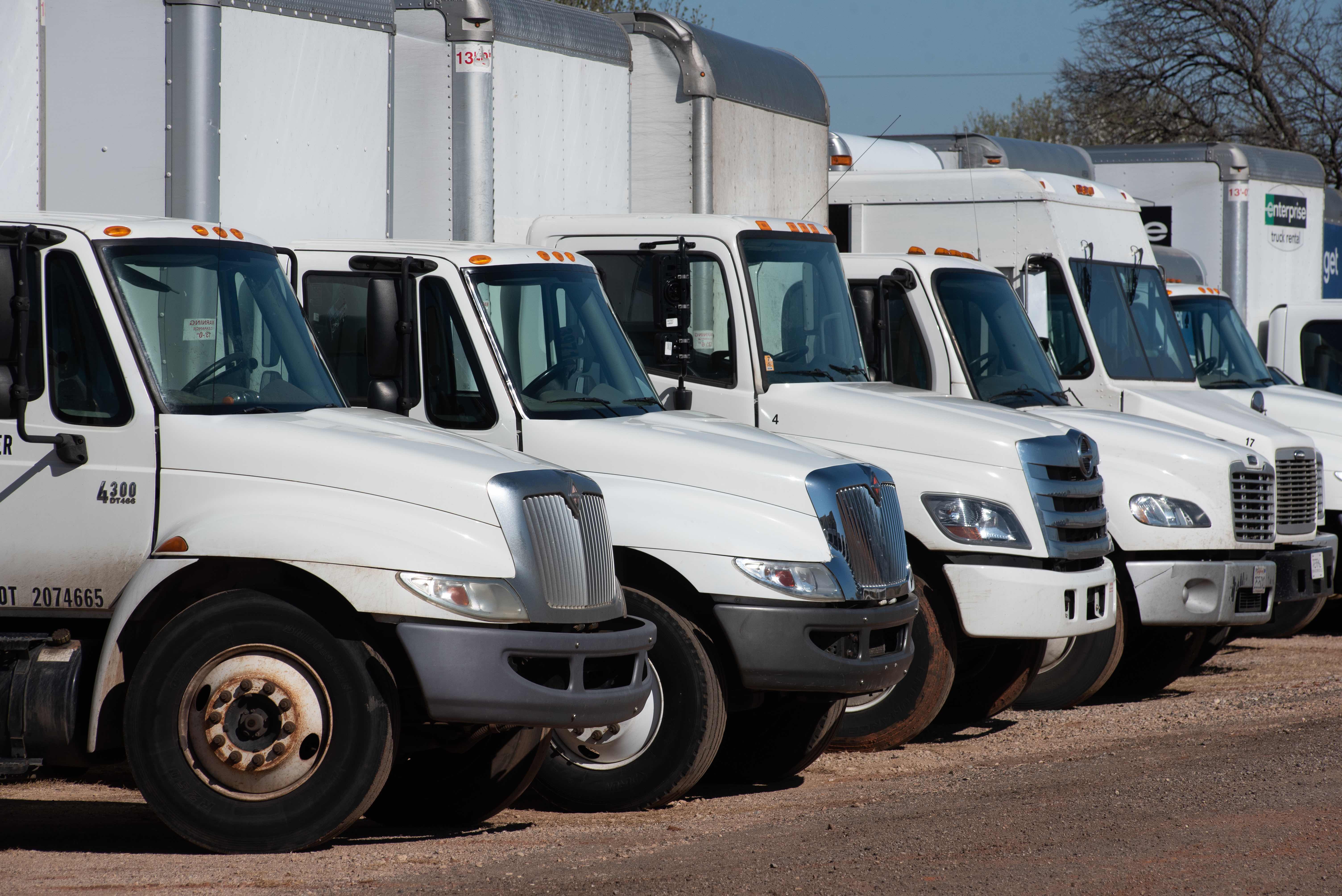 a lineup of commercial trucks and vans