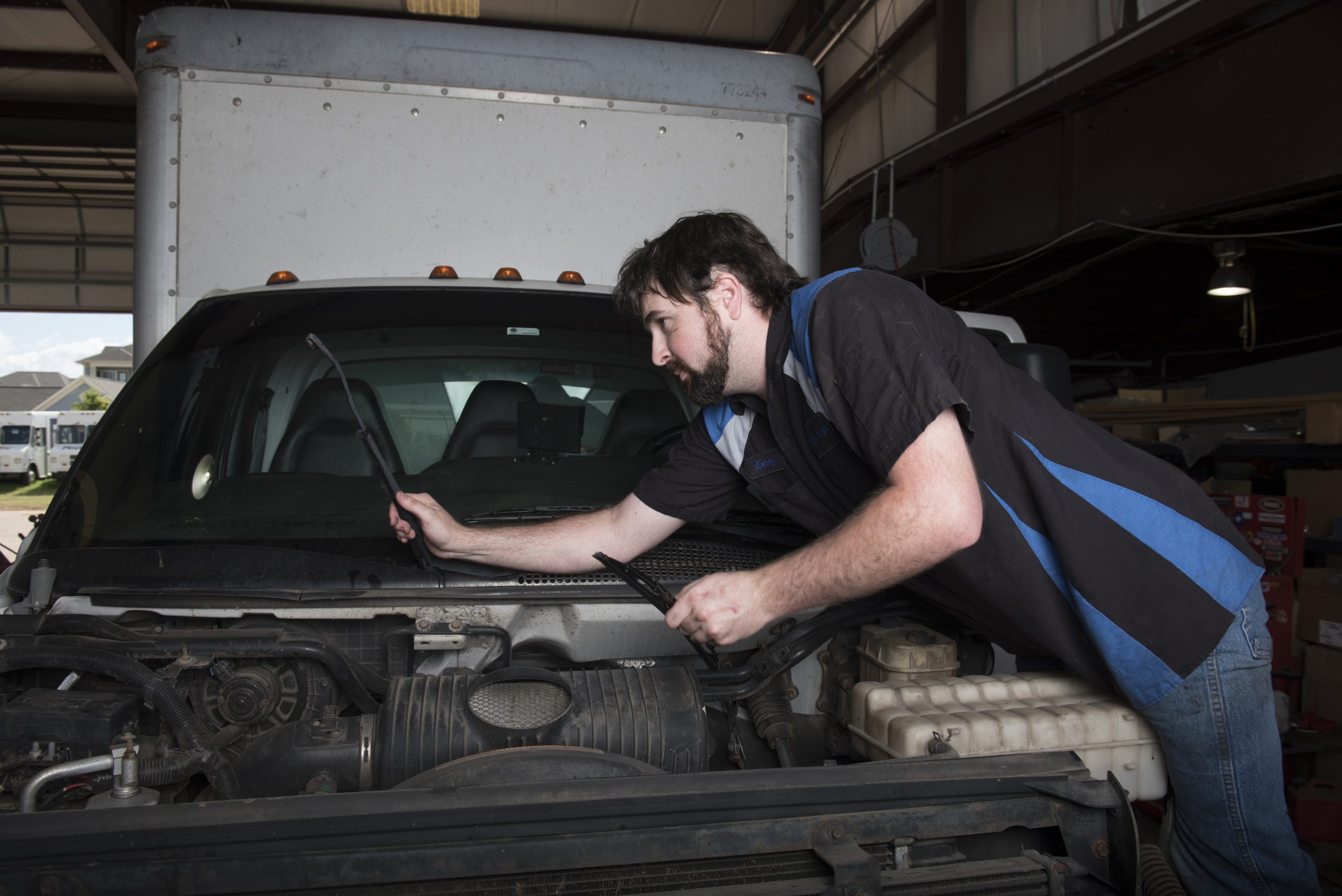 mechanic conducting truck repair and maintenance