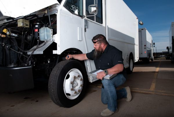 TruckNTrailer mechanic checking a truck